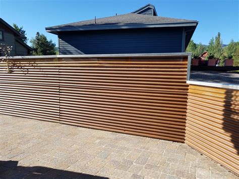 fencing with corrugated metal panels